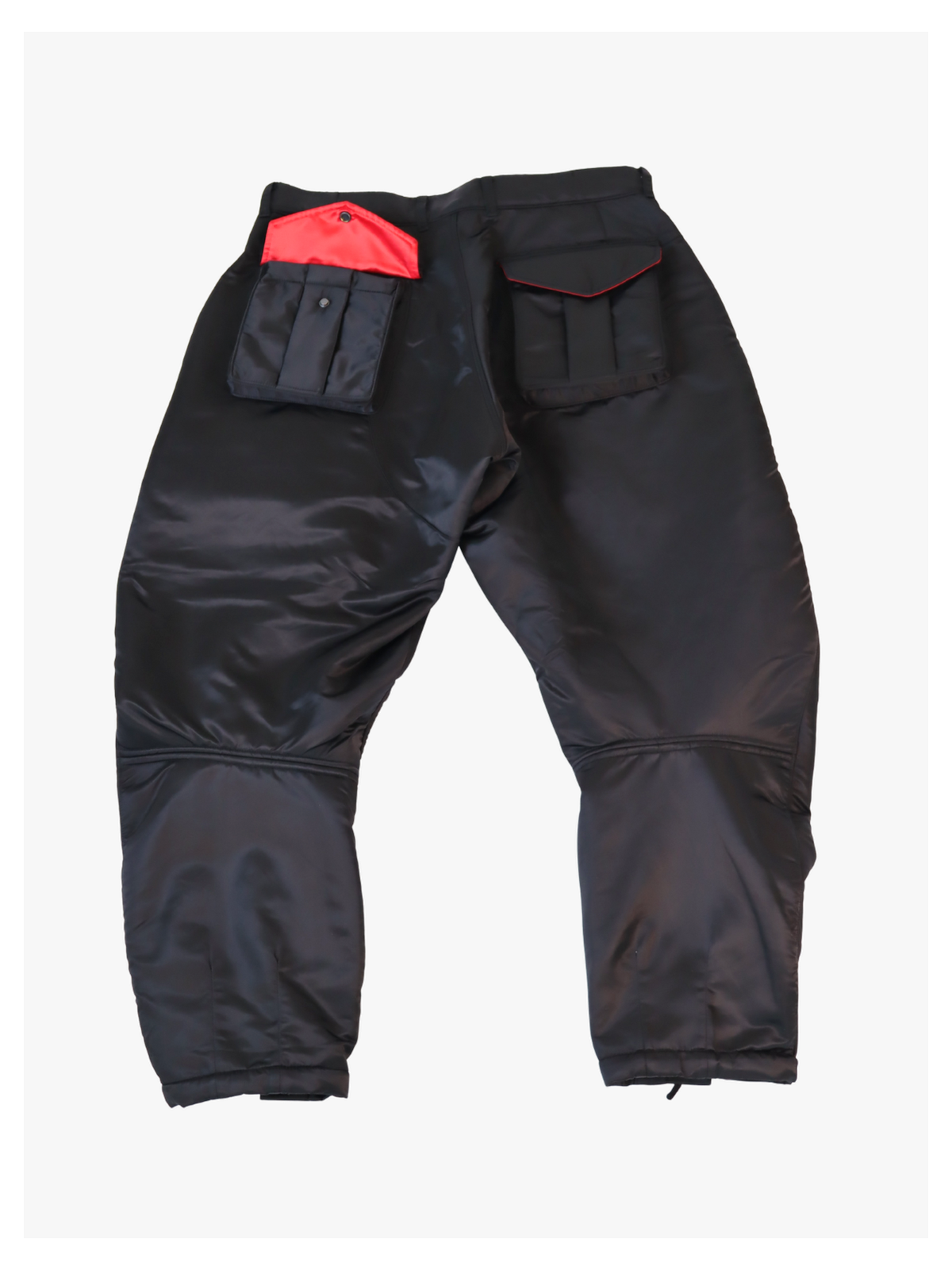 Back view of black and red satin utility pants with matching oversized cargo pockets and adjustable drawstring cuffs